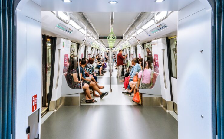 people sitting on train seat public transport