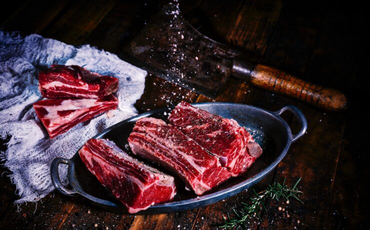 sliced meat on black wooden table salt steak