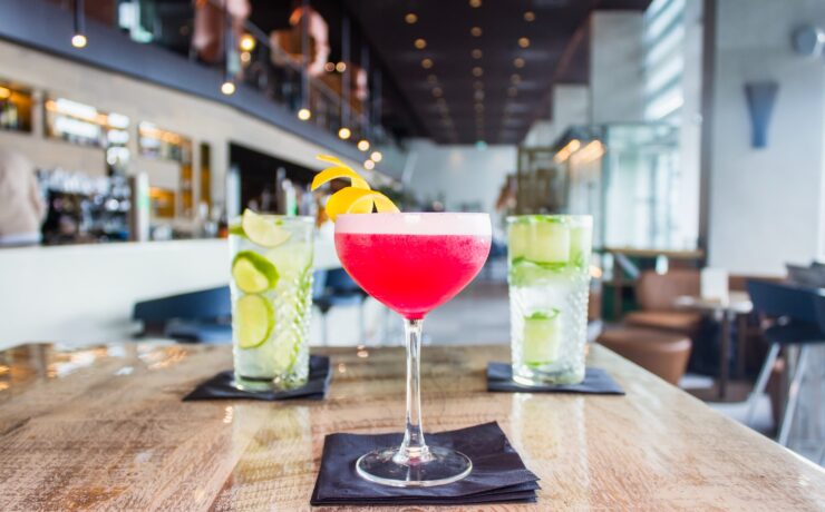 long-stem wine glass filled with red liquid alcohol spirit cocktail drink