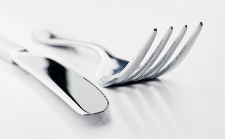 two silver bread knife and fork