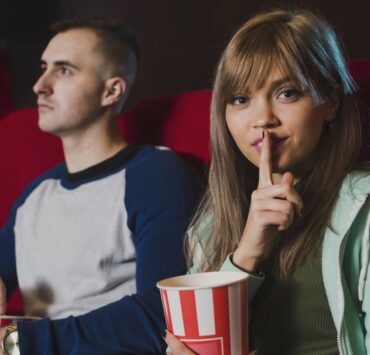 girl shutting up cinema boy friends