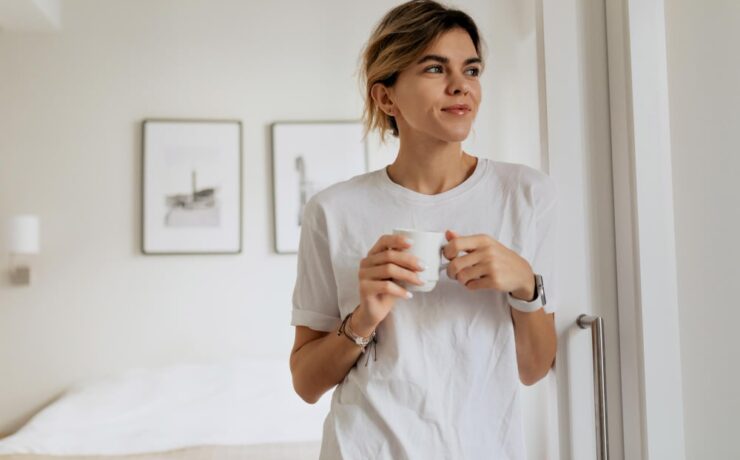 woman with a cup looking