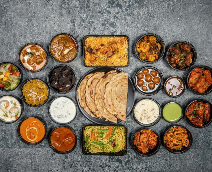 Wide variety of traditional Indian dishes displayed together in a flat lay style.