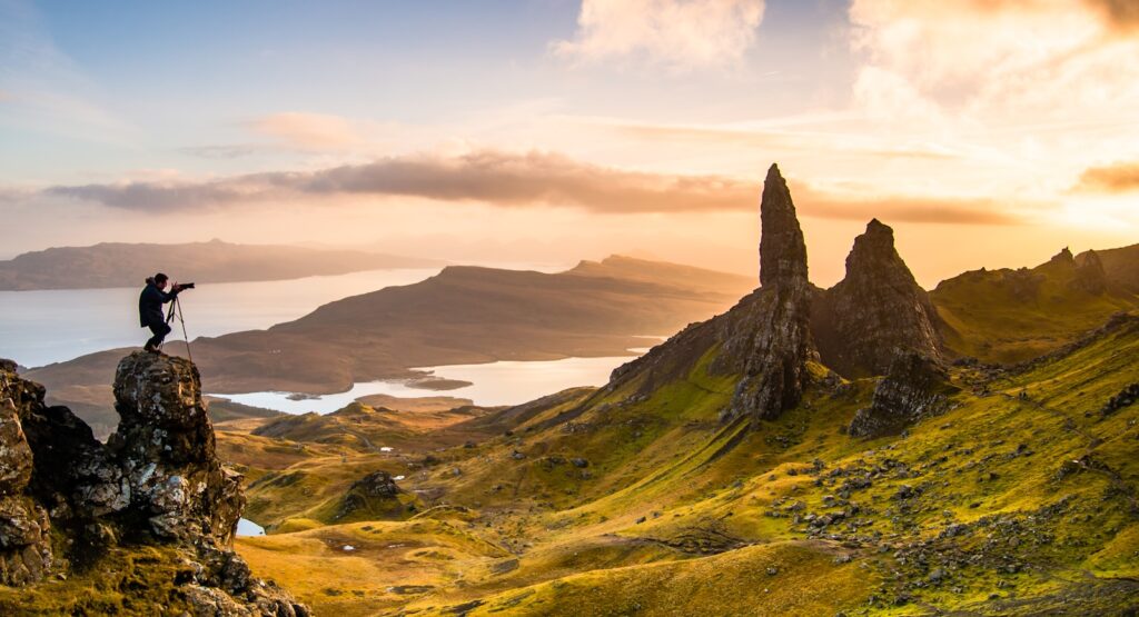 man standing on rock outer hebrides scotland