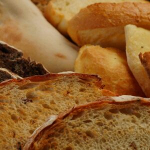 A close-up of various freshly baked bread showcasing texture and color.