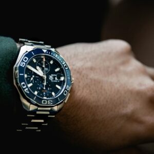 round black chronograph watch at 5:50